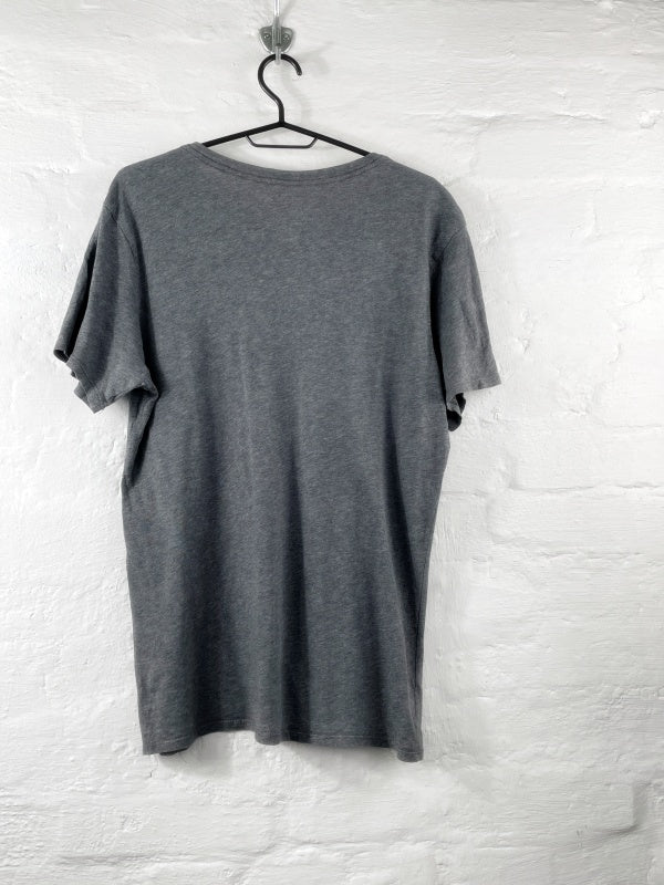 Nike – The Nike Tee with red Swoosh print (approx. late 2010s)