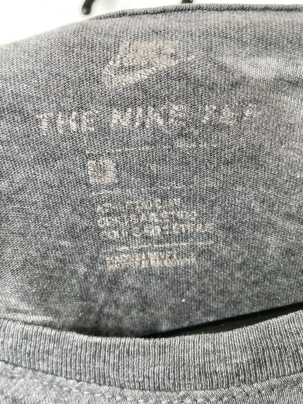 Nike – The Nike Tee with red Swoosh print (approx. late 2010s)