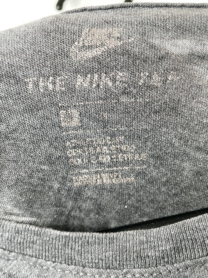 Nike – The Nike Tee with red Swoosh print (approx. late 2010s)